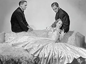 Prints of Joan Crawford reclines in the arms of Alan Curtis as Spencer Tracy watches in this MGM drama Mannequin that is directed by Frank Borzage A Glamorous Life Captured: Joan Crawford with Spencer Tracy and Alan Curtis