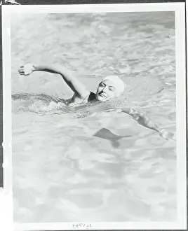 Prints of (Original Caption). California: A Film Queen At Play. After the day's work before the cameras and between pictures, Joan Crawford, M-G-M star, finds relaxation and diversion in a variety of sports A Glamorous Life Captured: Joan Crawford Swimming in Pool