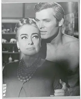 Prints of (Original Caption). Joan Crawford and Ty Hardin in a scene from the movie: Berserk. 1967 A Glamorous Life Captured: Joan Crawford and Ty Hardin