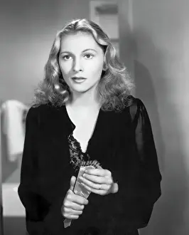 Joan Fontaine Holding Hair Brush