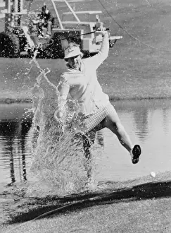 Joanne Carner Swinging Golf Ball in Water