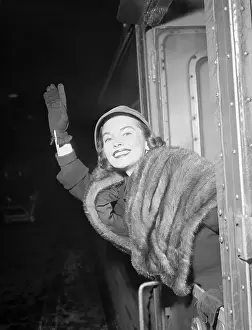 Joanne Dru Waving Upon Arrival
