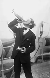 Jock Hutchinson Drinking from Trophy