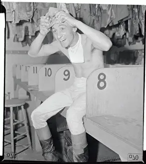 Jamaica Prints: Jockey Eddie Arcaro Holding Ice to Head