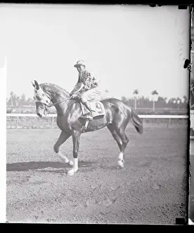 Jockey Riding Horse Around Track
