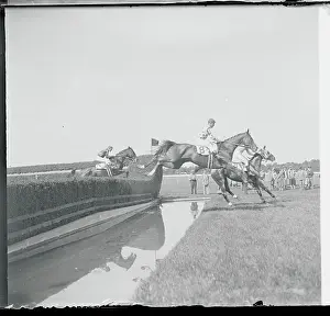 Elmont Prints: Jockeys Riding Horse and Jumping During Competition