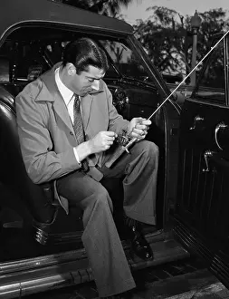 Outfielder Prints: Joe Dimaggio In Auto Holding Fishing Rod