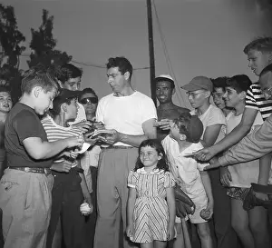 Autographing Prints: Joe DiMaggio with Autograph Seekers