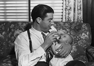 Joe DiMaggio Holding His Infant Son