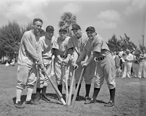 Joe DiMaggio and Players Posing Holding Bats
