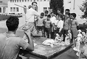 Joe Dimaggio Posing for Sculptor