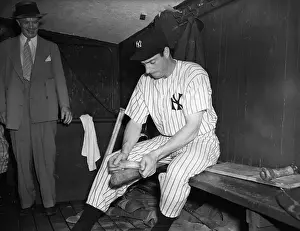 Outfielder Prints: Joe Dimaggio Preparing Bat For Game
