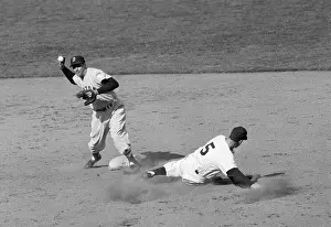 Joe Dimaggio Sliding As Baseman Throws