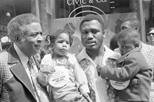 Foundation Prints: Joe Frazier Holds Two Kids with Sickle Cell