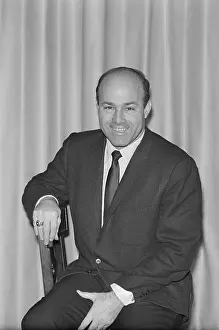 Joe Garagiola Sitting on Stool