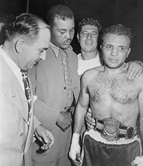Joe Louis Adjusting Championship Belt on Jake LaMotta