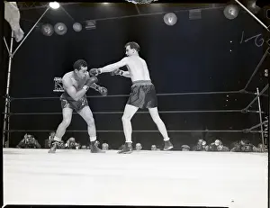 Joe Louis Ducks as Boxer Throws Punch