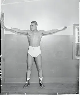 Joe Louis Holding His Arms Out