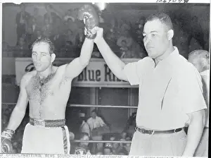 Joe Louis Holding Up Carl Olson's Arm