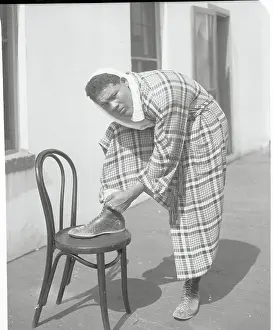 Joe Louis Lacing His Shoes