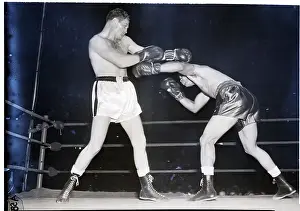 Joe Louis Launches Left at Opponent
