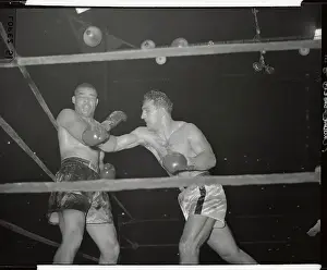 Joe Louis Reeling from a Punch by Rocky Marciano