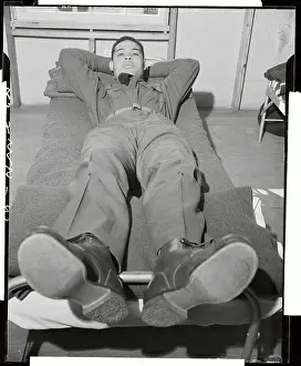 Joe Louis Resting on His Army Cot