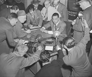 Taking Prints: Joe Louis Shown Takling to Reporters