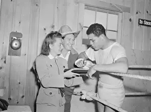 Greenwood Lake Prints: Joe Louis Signing Autograph for Olivia De Havilland