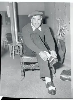 Joe Louis Tying His Shoes