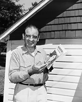 Joe Mccarthy Holds Book/Pamphlet On Hims