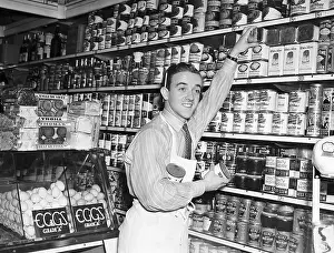 Groceries Prints: Joe McMichael Stocking Grocery Shelves