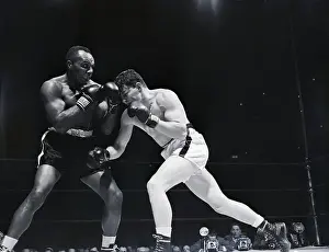 Blocking Prints: Joe Walcott (L) Blocks Rex Layne'S Punch