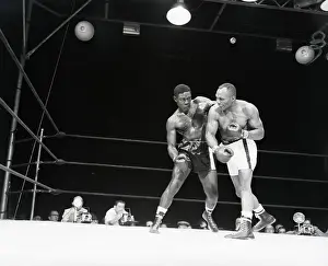 Bout Prints: Joe Walcott Tries To Punch Ezzardcharles