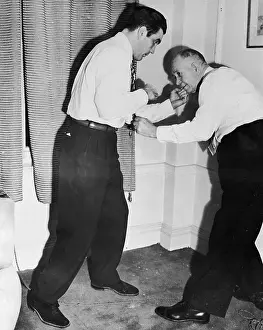 Athletic Trainer Prints: Joey Maxim Demonstrating Knockout Punch