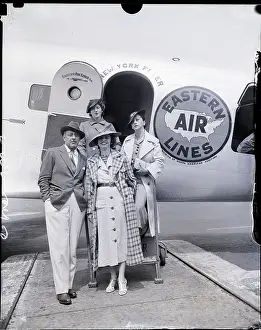John Barrymore Steppig Off Plane with Party