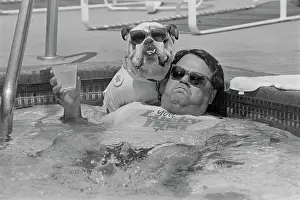 Pool Prints: John Bisciglia With Pet Bulldog in Pool
