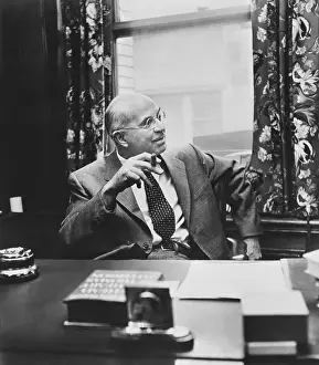 John Dos Passos Smoking a Cigar
