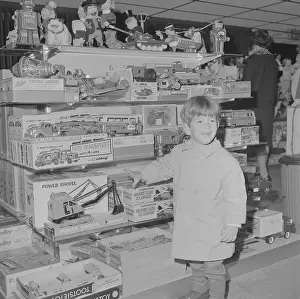 John F. Kennedy Jr. Enjoying Toy Store