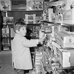 John F Kennedy Jr Enjoying Toy Store