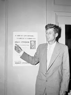 John F. Kennedy Pointing to a Poster