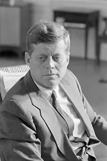 John F. Kennedy Seated In Office