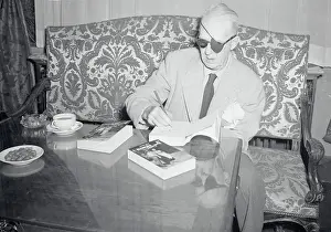 John Ford Autographing One of His Books