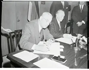 John Foster Dulles Signing a Treaty