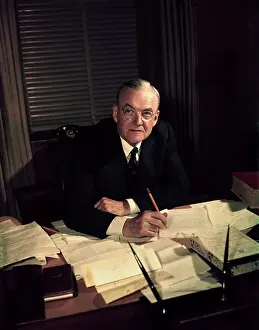 John Foster Dulls Sitting at his Desk