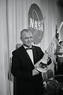 Cosmic Chronicle Prints: John Glenn Holding Mercury Model