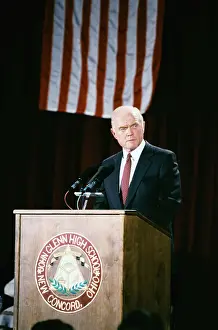 John Glenn at Podium near American Flag