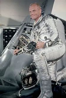 Astronaut Prints: John Glenn Standing Beside a Mercury Capsule