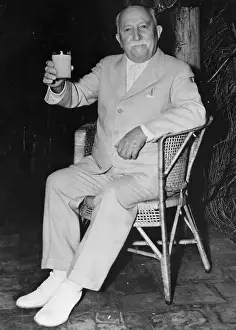 Juice Prints: John Harvey Kellogg Sitting and Holding Glass