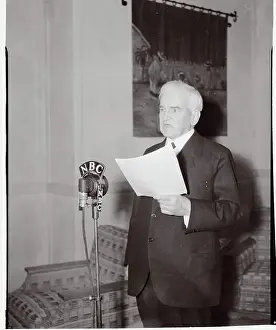John Hessin Clarke Speaking at Microphone